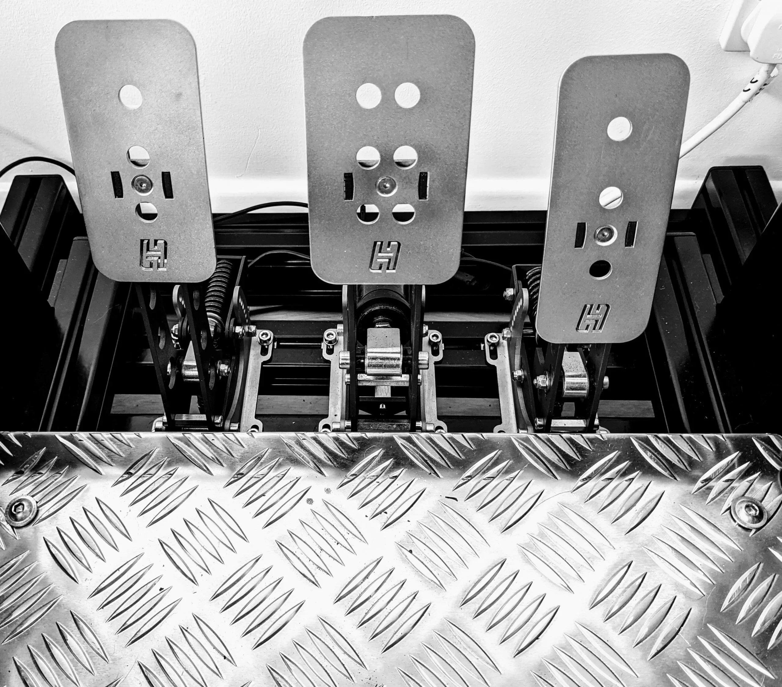 Close-up of Heusinkveld Sprint sim racing pedals, showing durable build and design. Why Heusinkveld Sprints are the best sim racing pedals you can own.