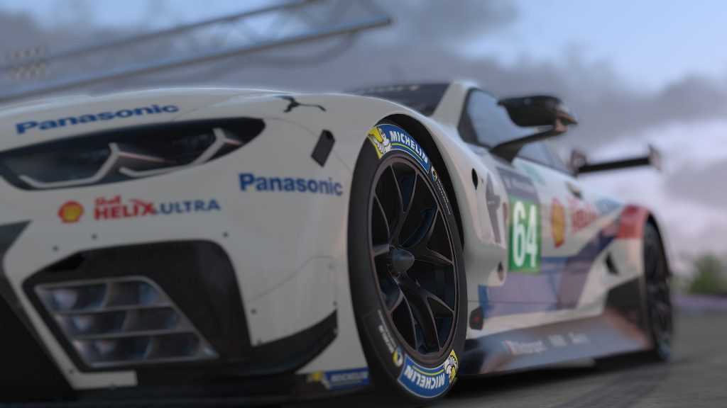 A short guide to Sim racing software featuring a detailed view of a racing car simulation image.