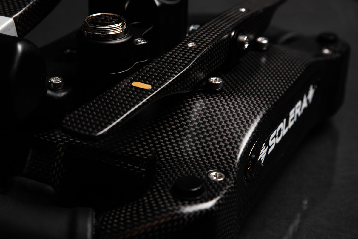 Handcrafted carbon fiber shell of the Sim-Lab Mercedes-AMG PETRONAS F1 Team sim racing steering wheel