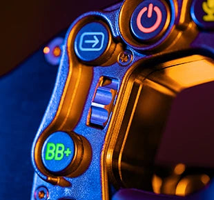Close-up of a colorful camera control panel with buttons and dials illuminated in soft light.