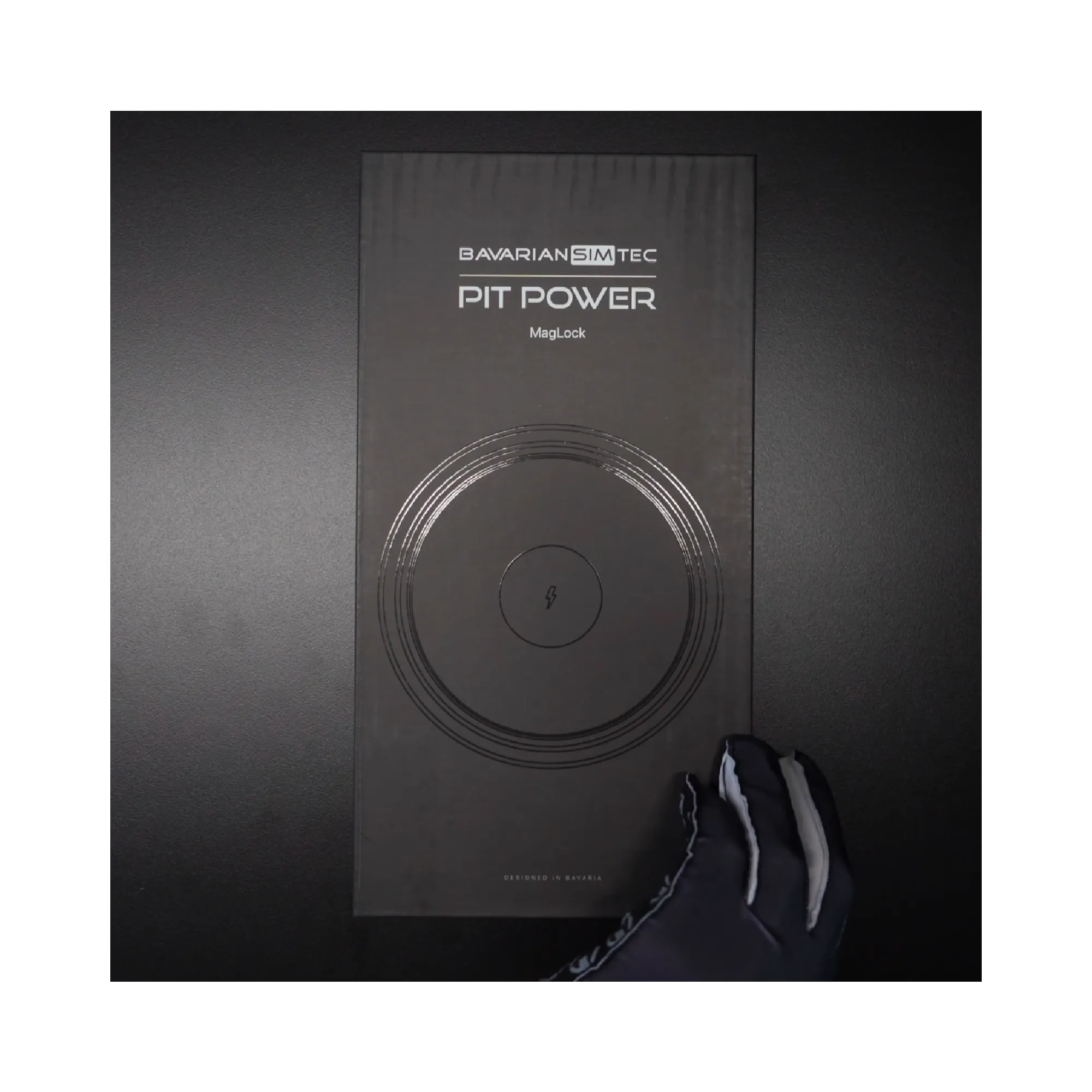 BavarianSimTec PitPower MagLock box showcasing the magnetic iPhone mount adhering to MagSafe standards for sim racing enthusiasts.