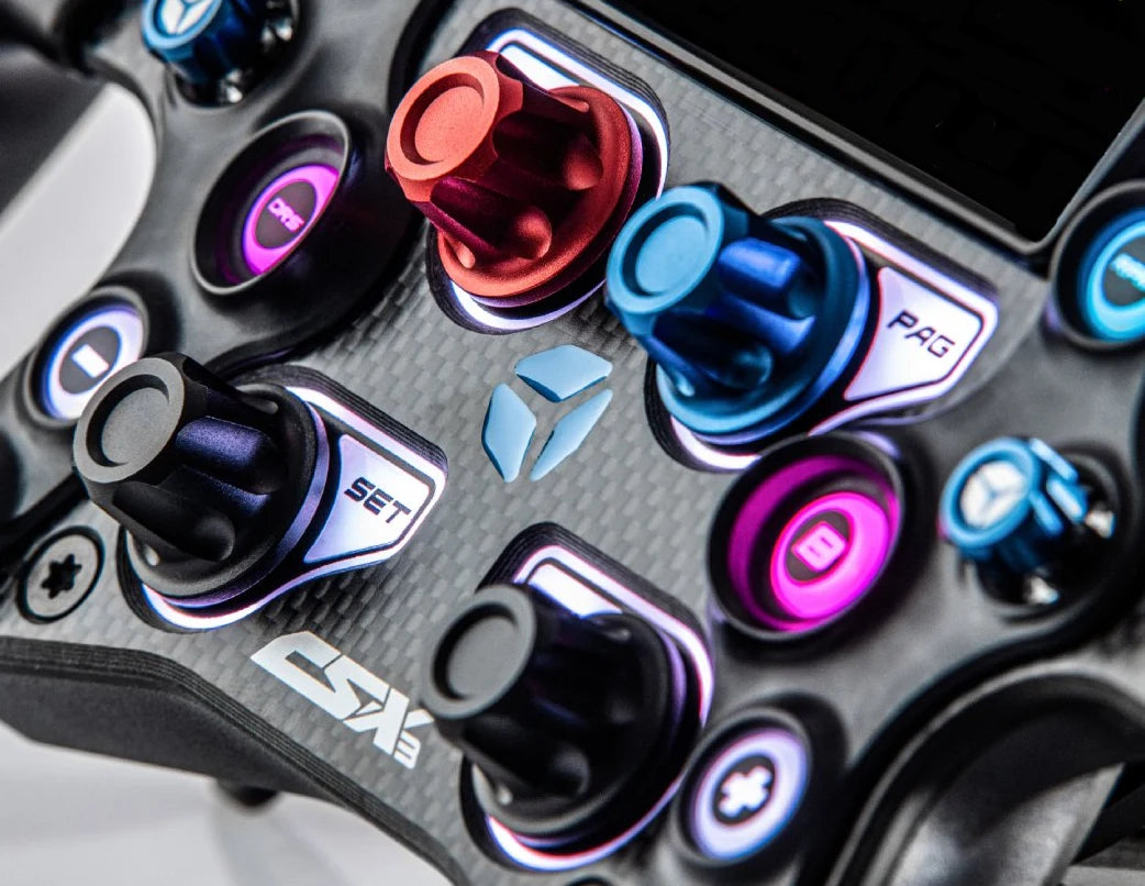 Close-up of a high-tech gaming controller with colorful buttons and dials on a carbon fiber surface.