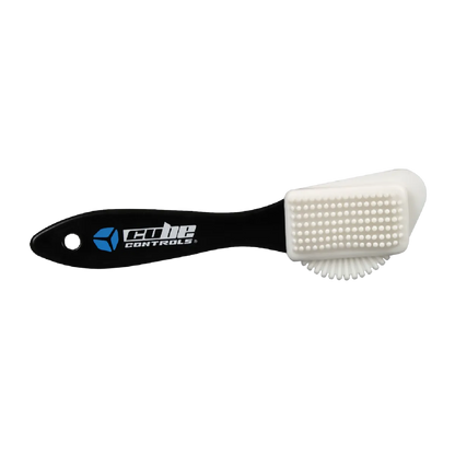 Cube Controls Suede Brush with brass bristles and rubber back for cleaning and maintaining suede steering wheels.