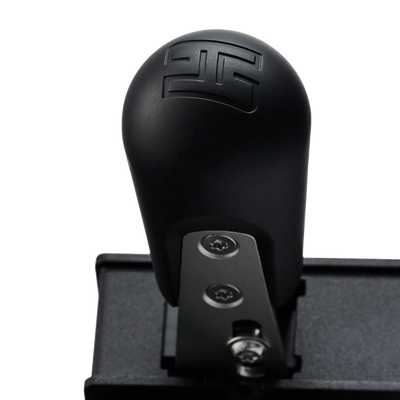 Close-up of the Heusinkveld MagShift Mini, a compact sequential shifter for sim racing, showcasing adjustable resistance and compact design.